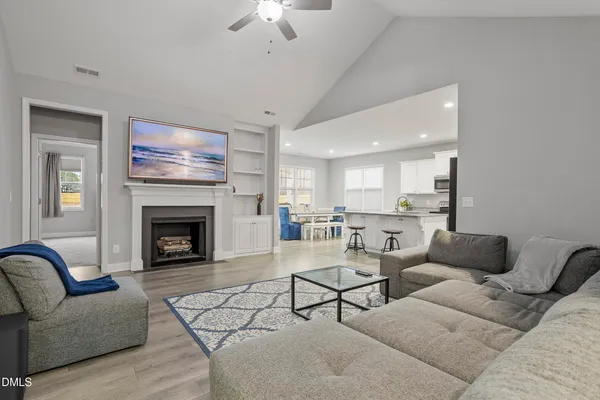 a living room with furniture and a fireplace