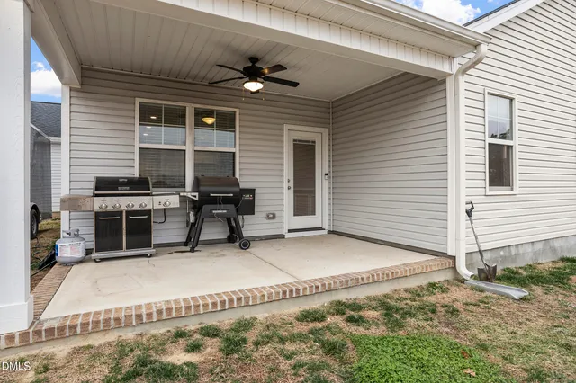 a view of house with backyard space