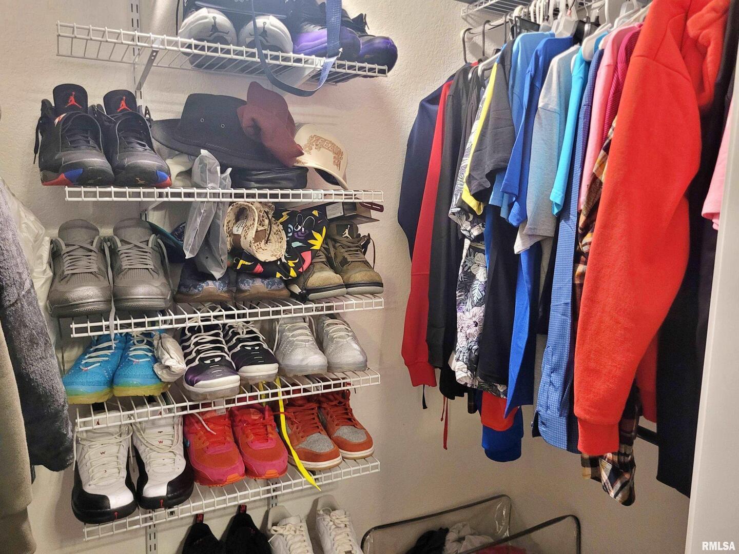 42 County Line Road Grand Chain, IL 62941 - Photo 22 of 40 a view of walk in closet with clothes and shoes