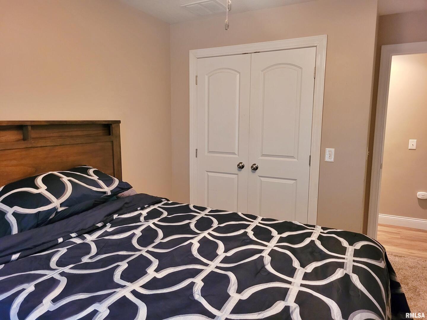 42 County Line Road Grand Chain, IL 62941 - Photo 27 of 40 a bedroom with a bed and a lamp