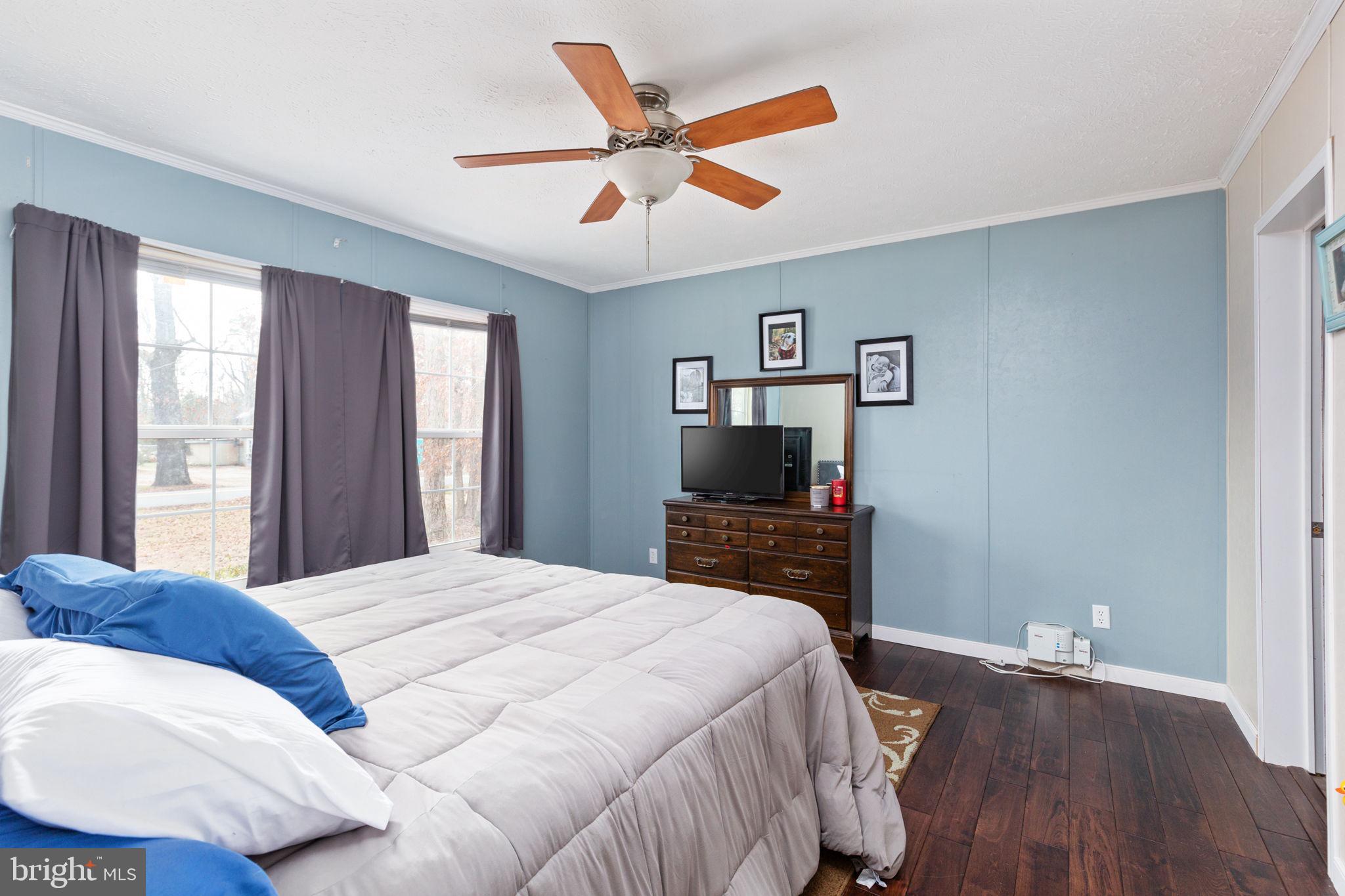 2300 Osborne Road Chester, VA 23831 - Photo 19 of 26 a bedroom with a bed and a flat screen tv