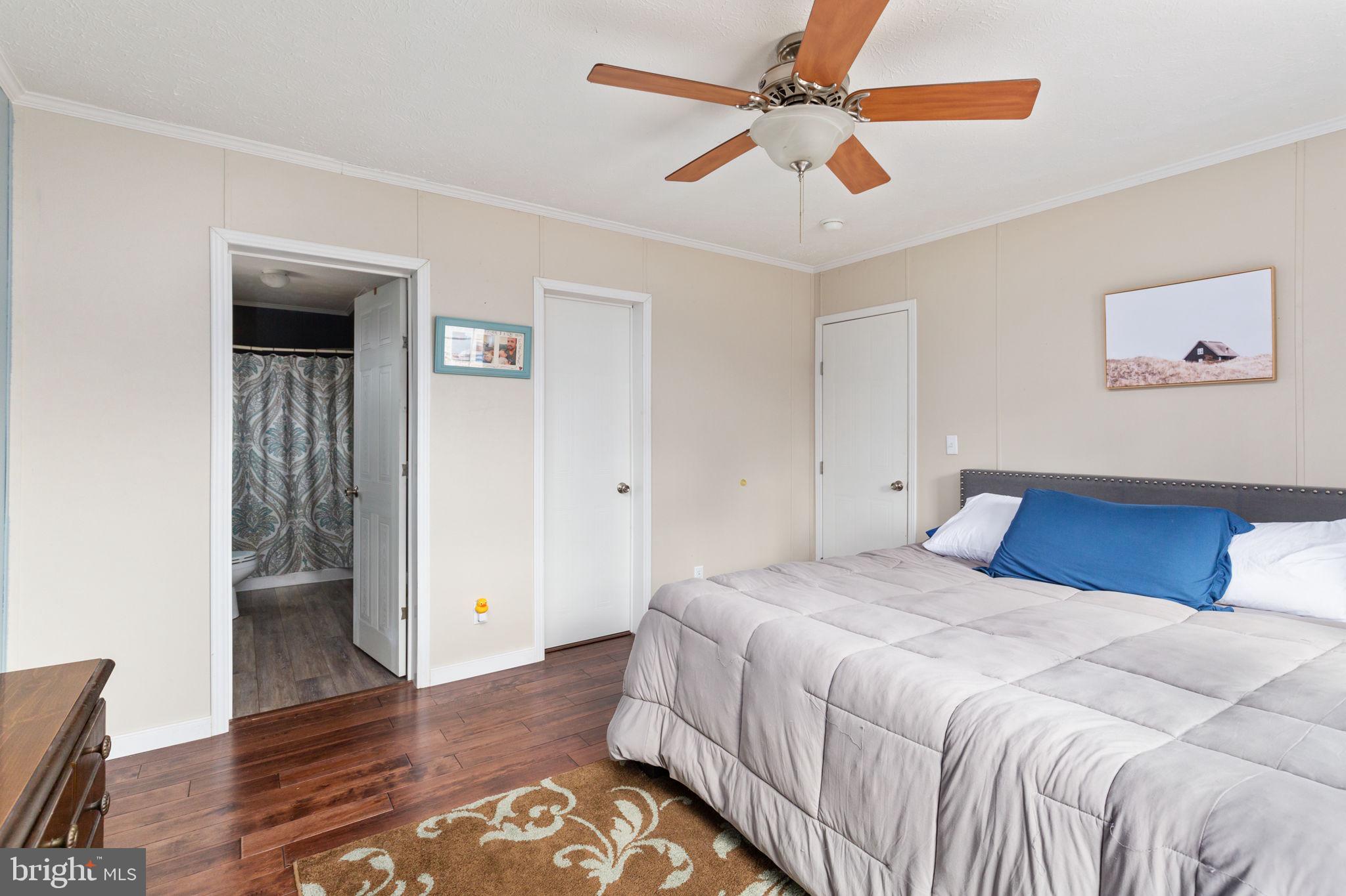 2300 Osborne Road Chester, VA 23831 - Photo 21 of 26 a bedroom with a large bed and a ceiling fan