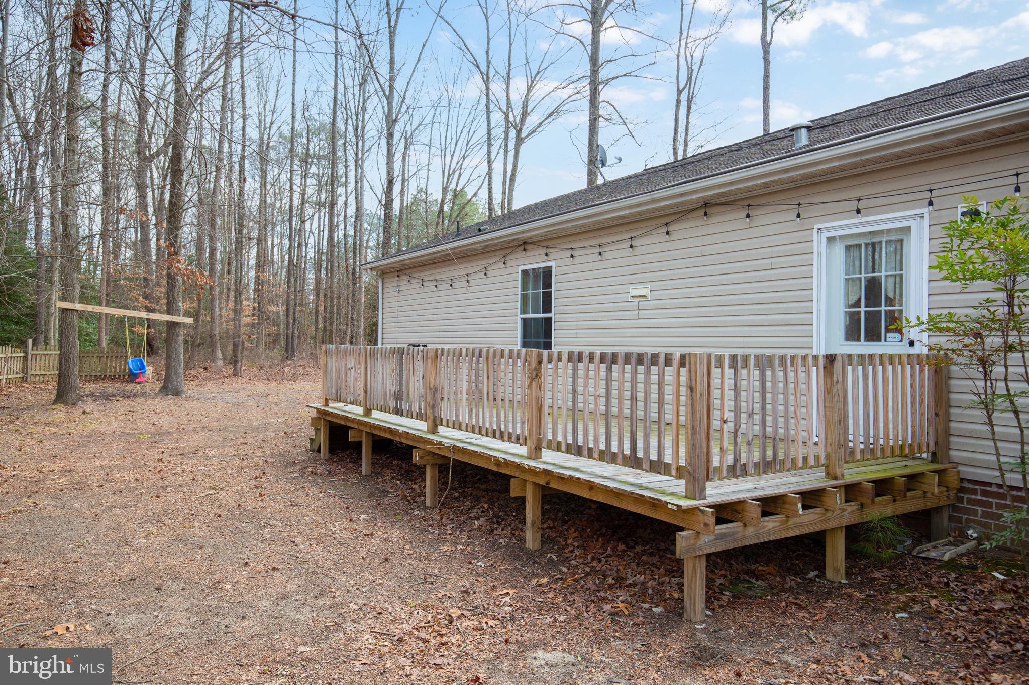 2300 Osborne Road Chester, VA 23831 - Photo 23 of 26 a backyard of a house with wooden fence and deck