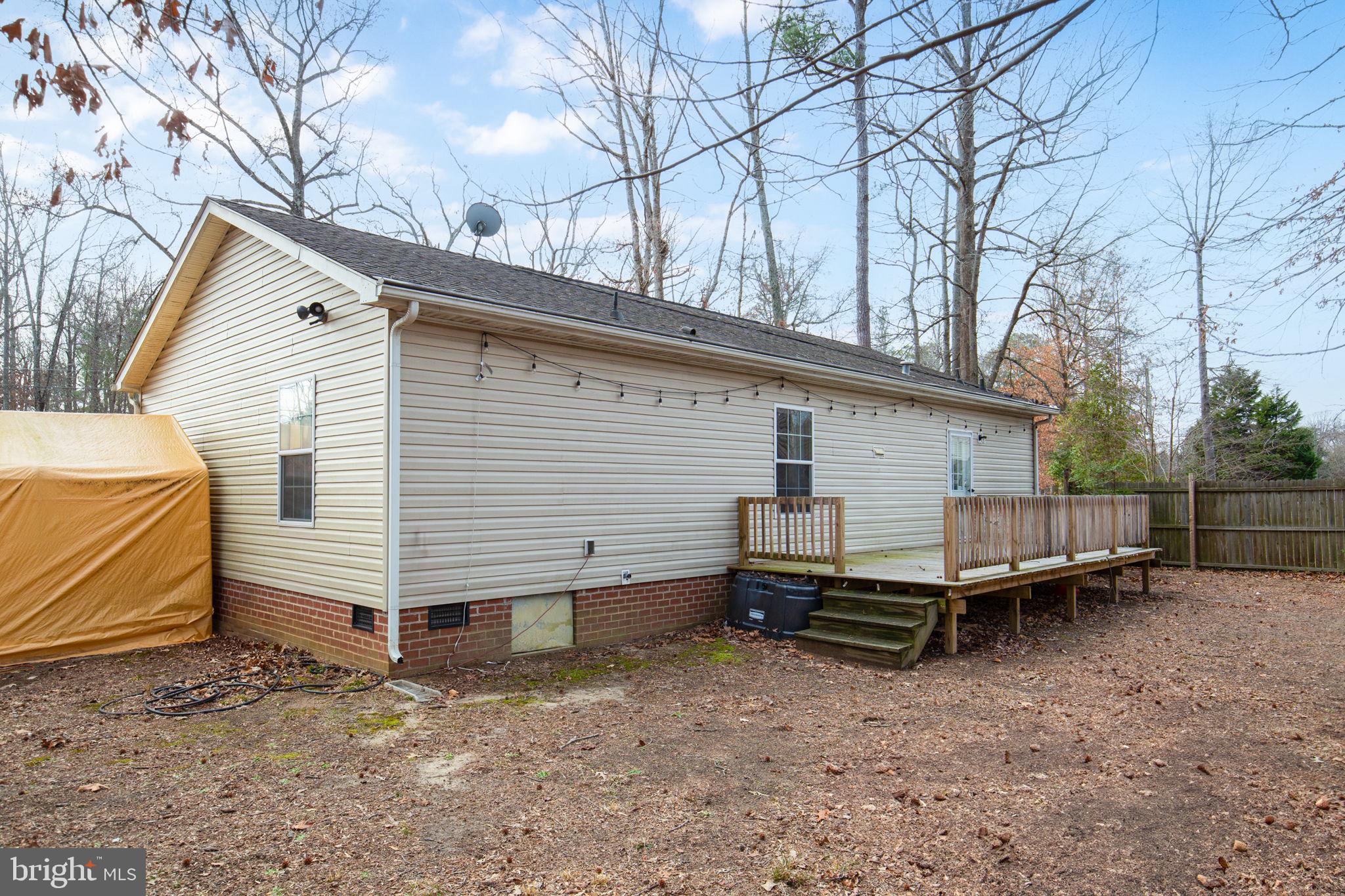 2300 Osborne Road Chester, VA 23831 - Photo 24 of 26 a view of a house with a yard and wooden fence