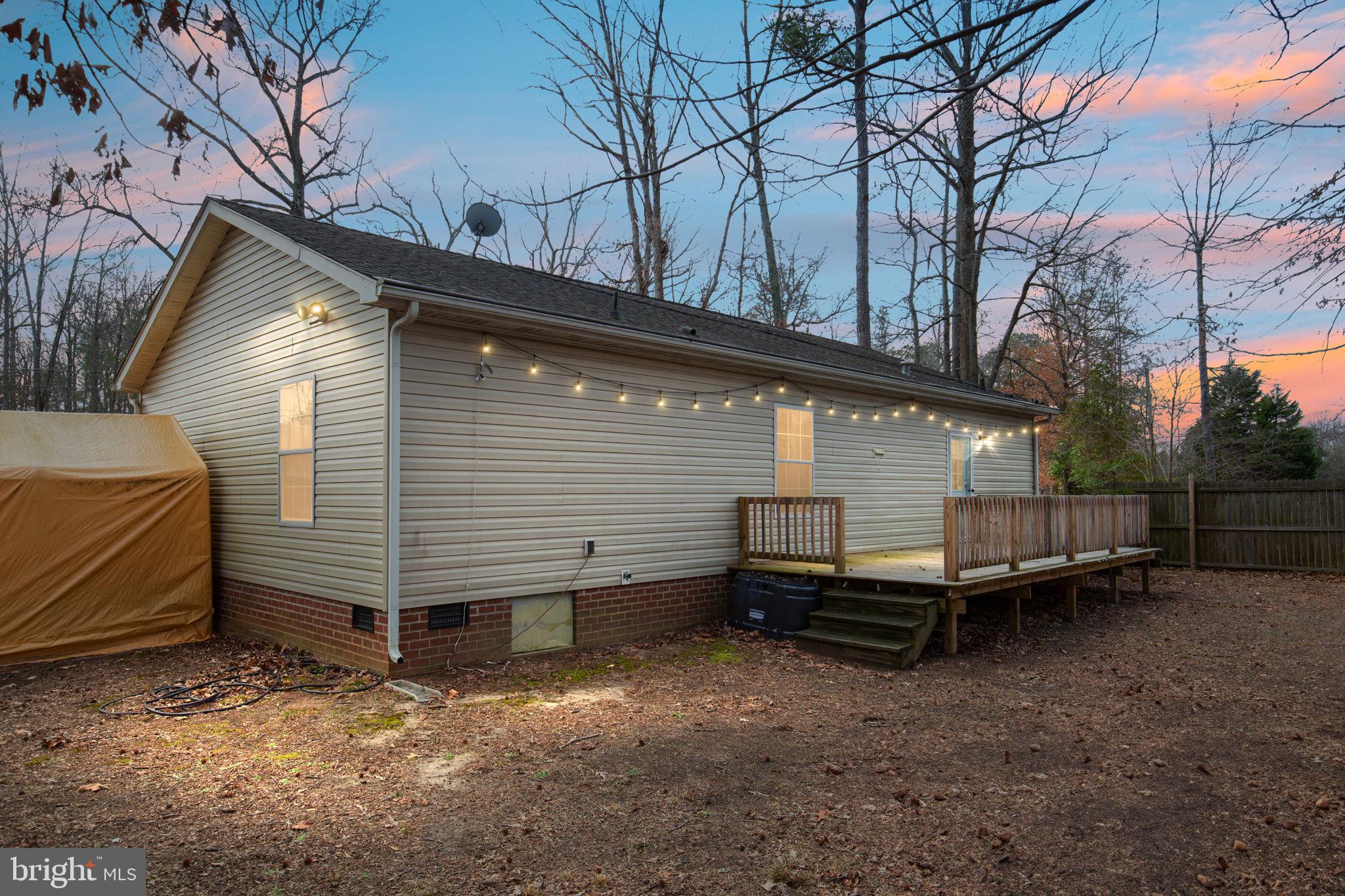 2300 Osborne Road Chester, VA 23831 - Photo 25 of 26 a view of a house with a yard and wooden fence