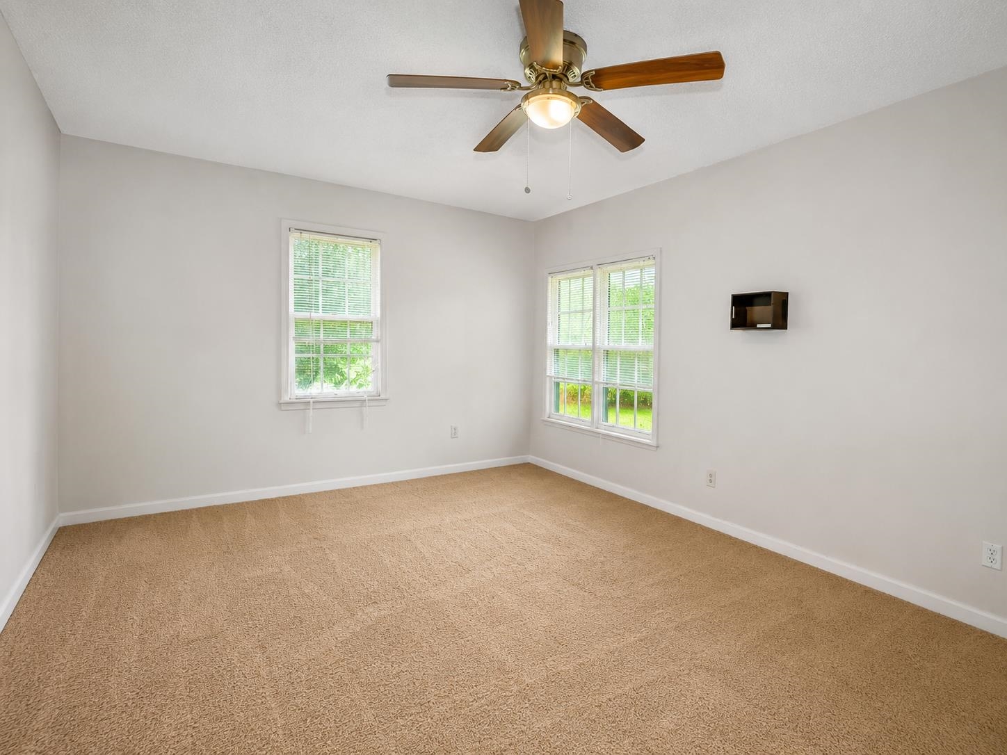 8488 Quito Road Millington, TN 38053 - Photo 11 of 30 an empty room with windows and fan