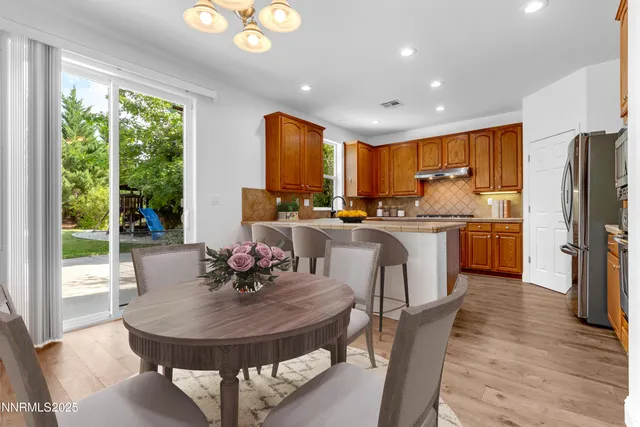 a kitchen with stainless steel appliances granite countertop a sink and cabinets