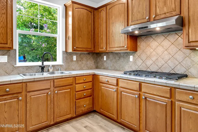 a spacious bathroom with a sink and a mirror