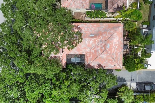 an aerial view of a house with a yard and garden