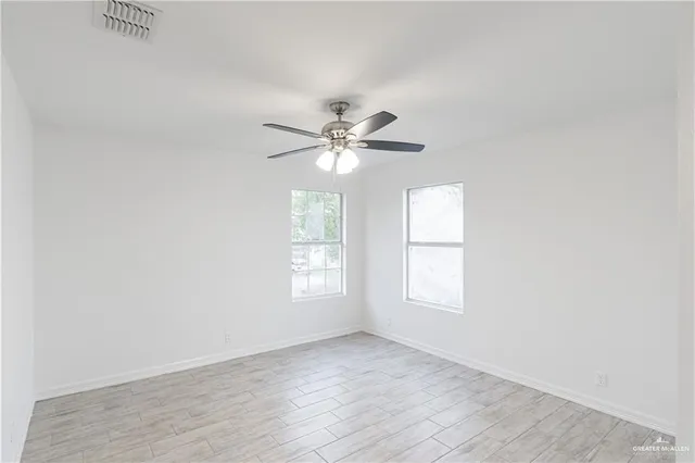 a view of an empty room with a window