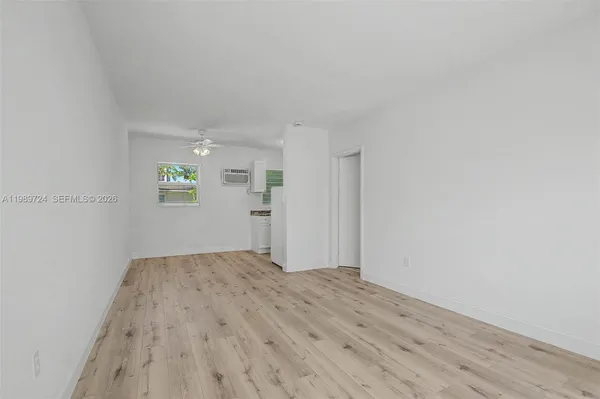 a view of an empty room and window