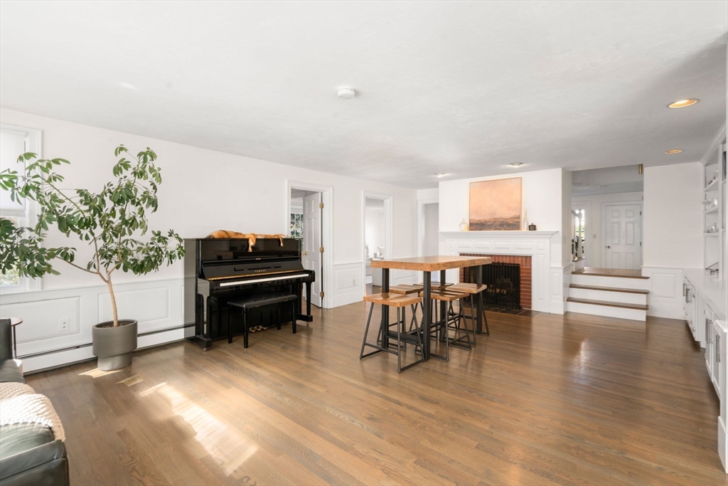 23 Bubbling Brook Road Walpole, MA 02081 - Photo 11 of 41 a living room with furniture and a fireplace