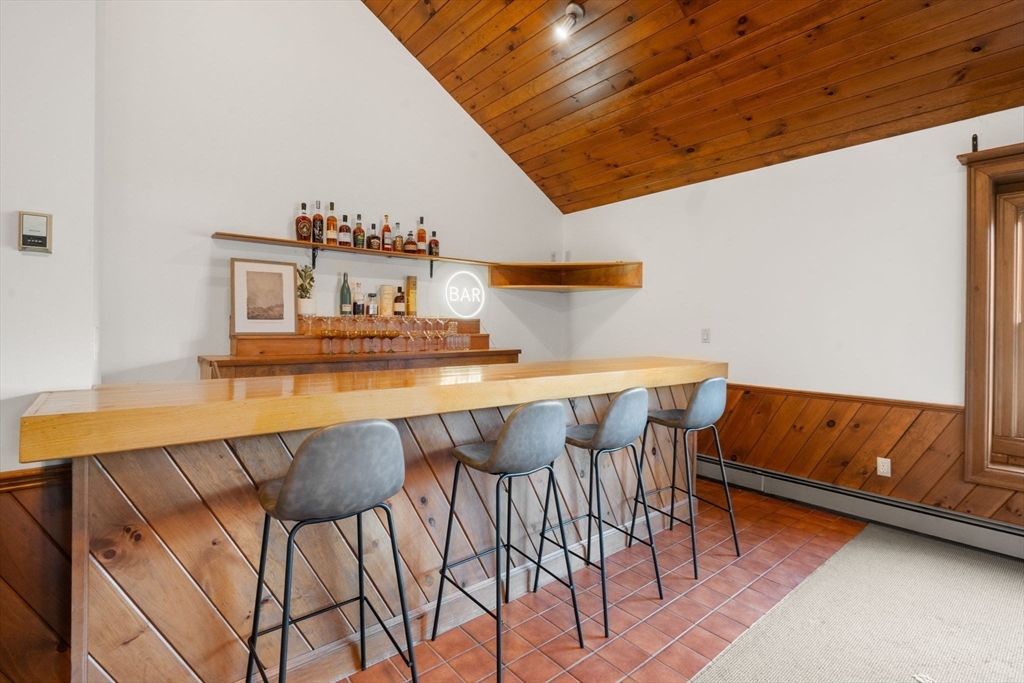 23 Bubbling Brook Road Walpole, MA 02081 - Photo 15 of 41 a kitchen with a table and chairs in it