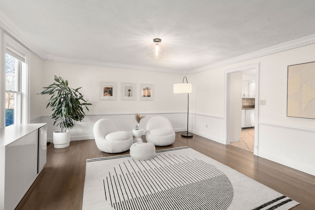 23 Bubbling Brook Road Walpole, MA 02081 - Photo 17 of 41 a bedroom with a bed and a potted plant