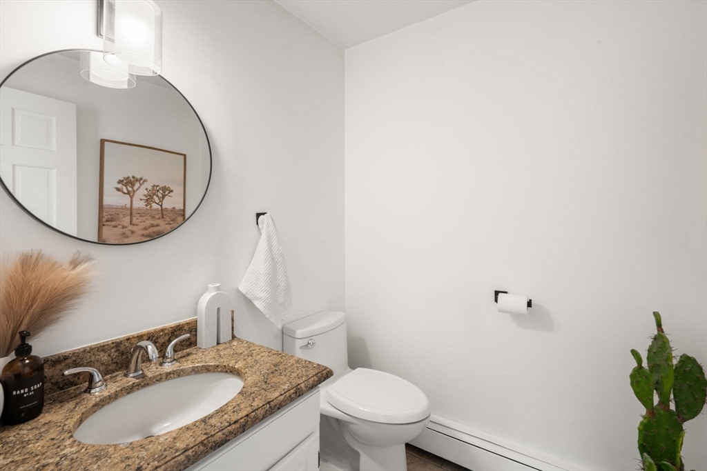 23 Bubbling Brook Road Walpole, MA 02081 - Photo 18 of 41 a bathroom with a granite countertop sink and a mirror