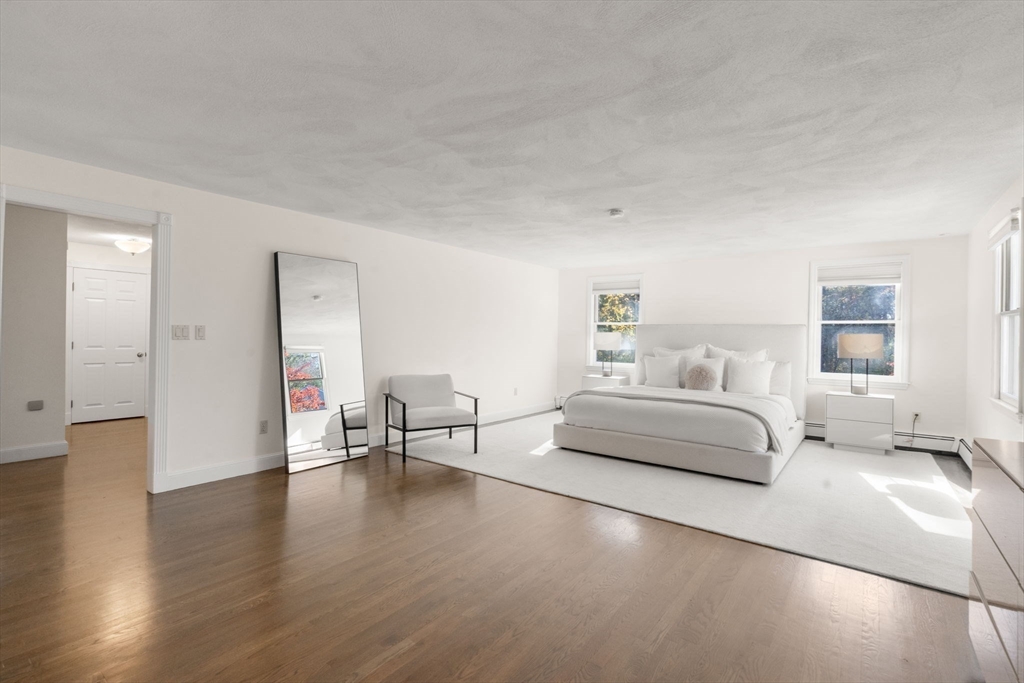 23 Bubbling Brook Road Walpole, MA 02081 - Photo 19 of 41 a bedroom with furniture and a wooden floor