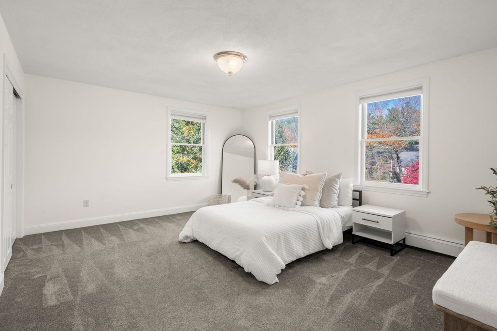 23 Bubbling Brook Road Walpole, MA 02081 - Photo 26 of 41 a bedroom with a bed and a window