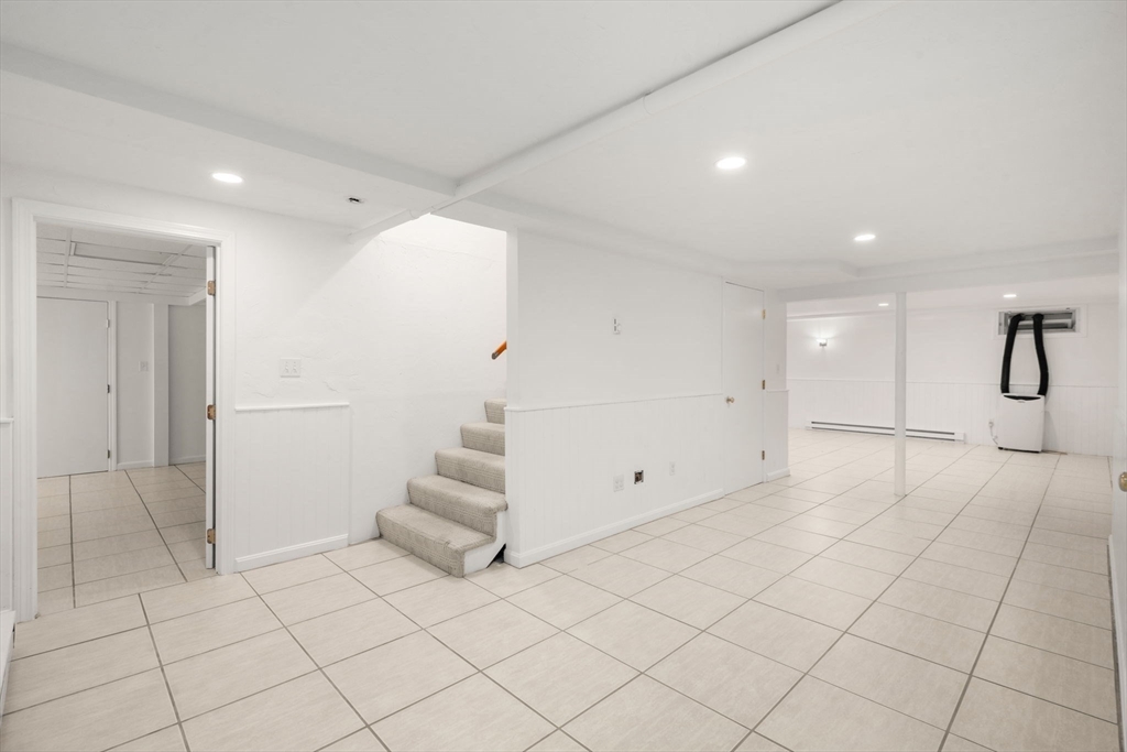 23 Bubbling Brook Road Walpole, MA 02081 - Photo 32 of 41 an empty room with white walls and white walls