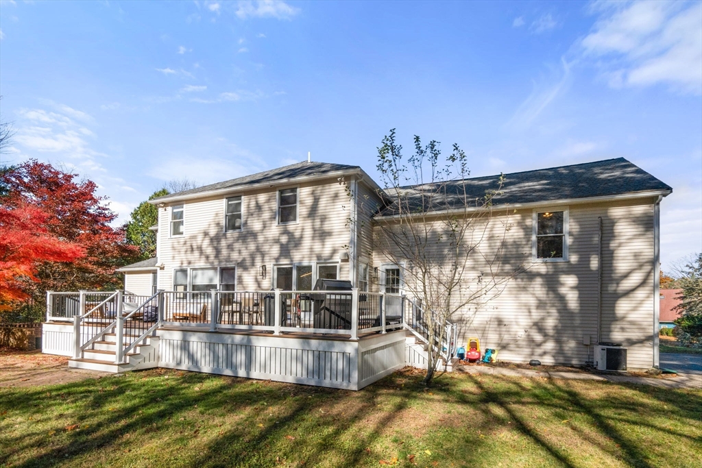 23 Bubbling Brook Road Walpole, MA 02081 - Photo 37 of 41 a view of a house with a big yard