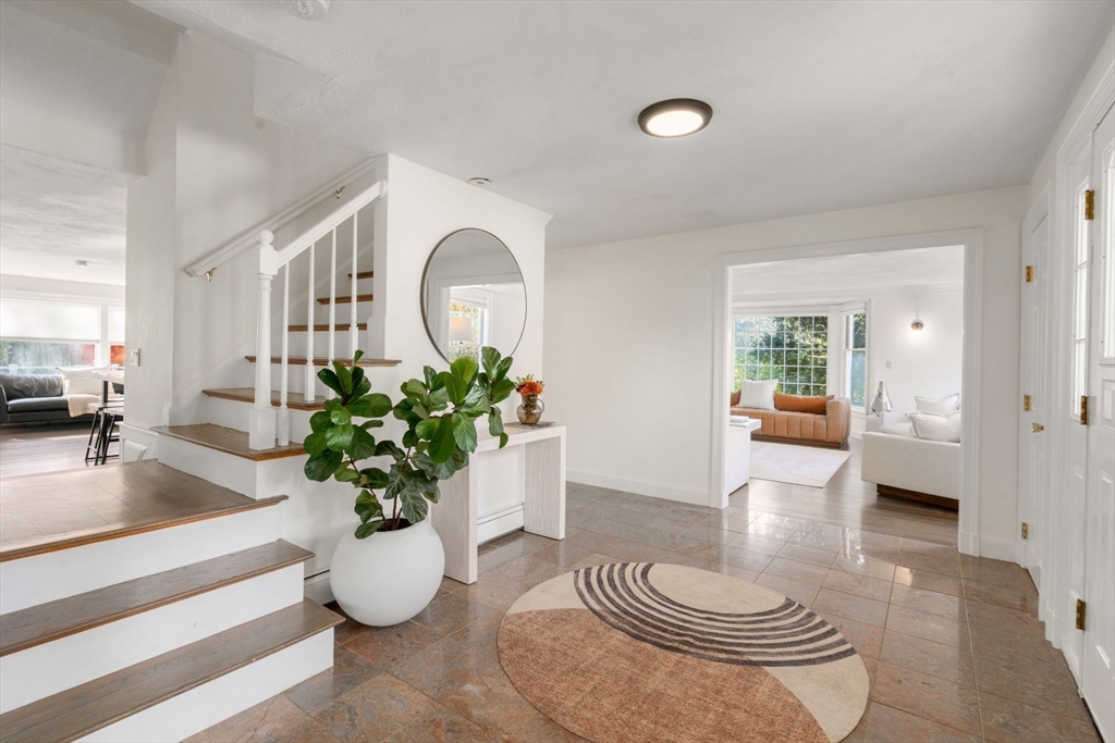 23 Bubbling Brook Road Walpole, MA 02081 - Photo 5 of 41 a living room with furniture and a potted plant