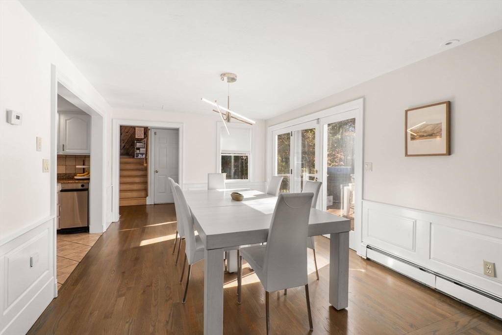 23 Bubbling Brook Road Walpole, MA 02081 - Photo 8 of 41 a view of a dining room with furniture and wooden floor