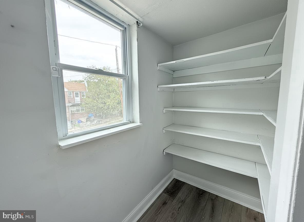 7332 Ruskin Road Philadelphia, PA 19151 - Photo 16 of 20 a storage room with racks on the wall