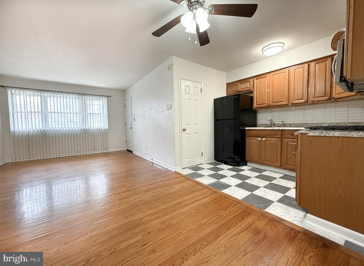 7332 Ruskin Road Philadelphia, PA 19151 - Photo 20 of 20 a view of a kitchen with a sink and wooden floor