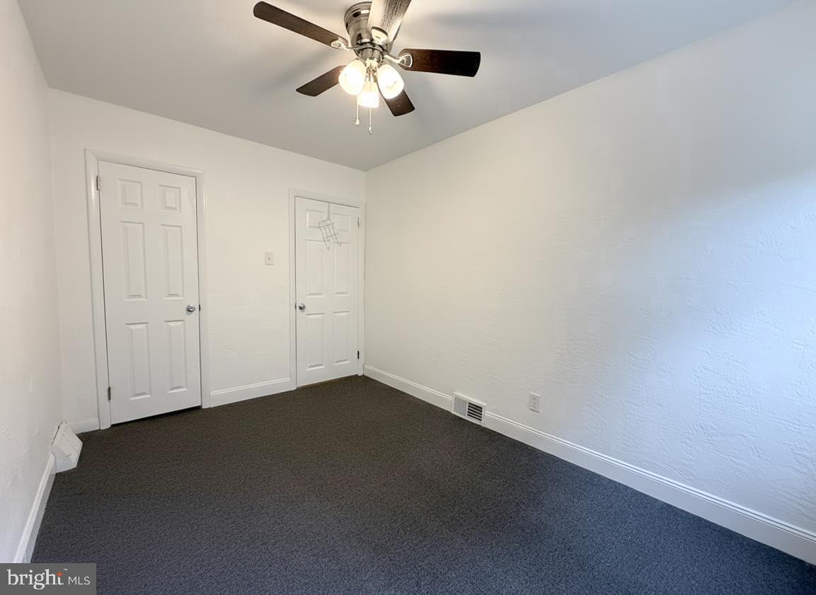7332 Ruskin Road Philadelphia, PA 19151 - Photo 4 of 20 an empty room with a ceiling fan and fan