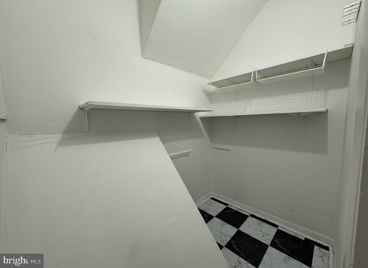 7332 Ruskin Road Philadelphia, PA 19151 - Photo 9 of 20 a view of staircase with empty racks