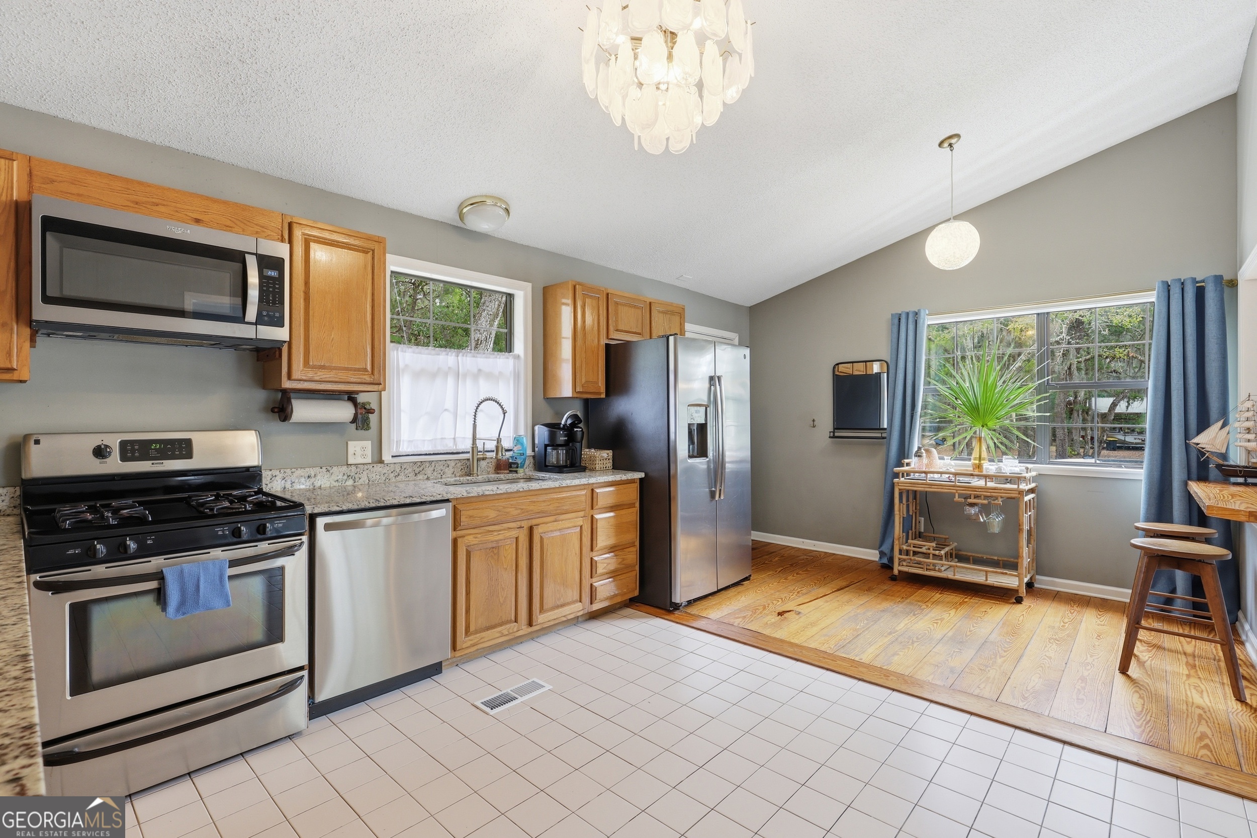 1629 South River Drive Townsend, GA 31331 - Photo 17 of 64 a kitchen with a stove a sink and a refrigerator