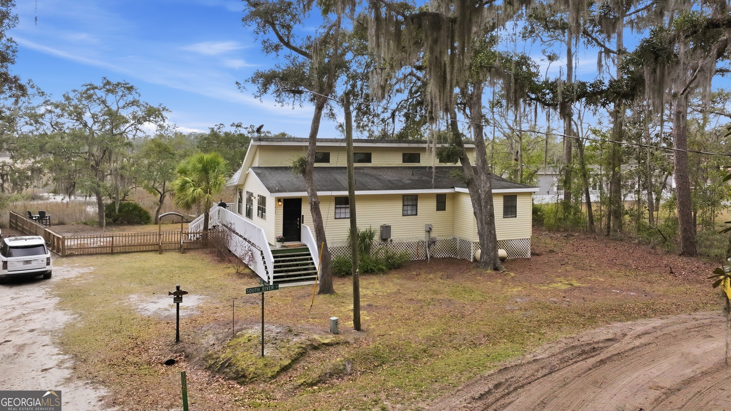 1629 South River Drive Townsend, GA 31331 - Photo 49 of 64 a house view with a backyard space