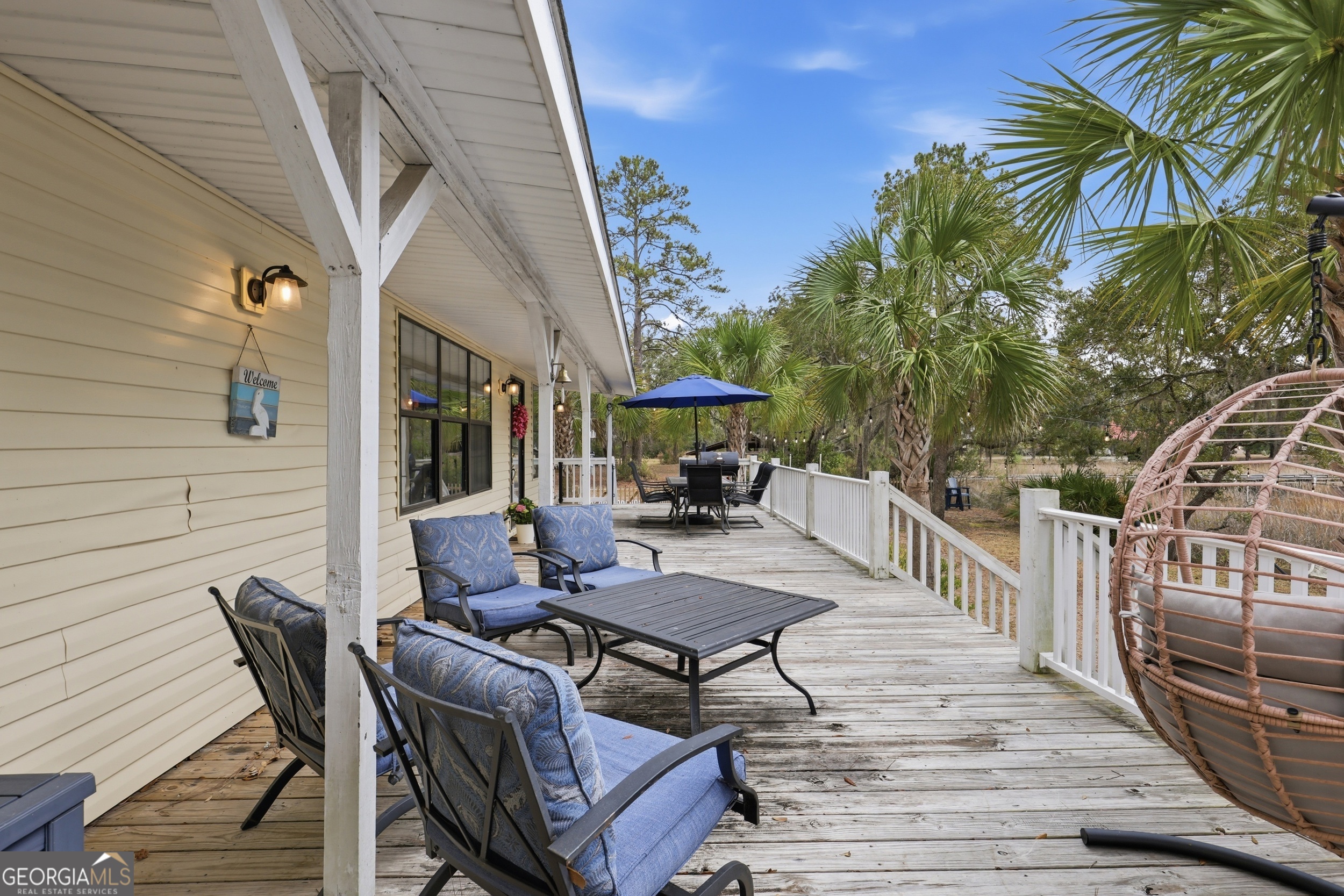 1629 South River Drive Townsend, GA 31331 - Photo 5 of 64 a view of a patio with a table and chairs