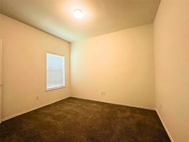 an empty room with a empty space and a window