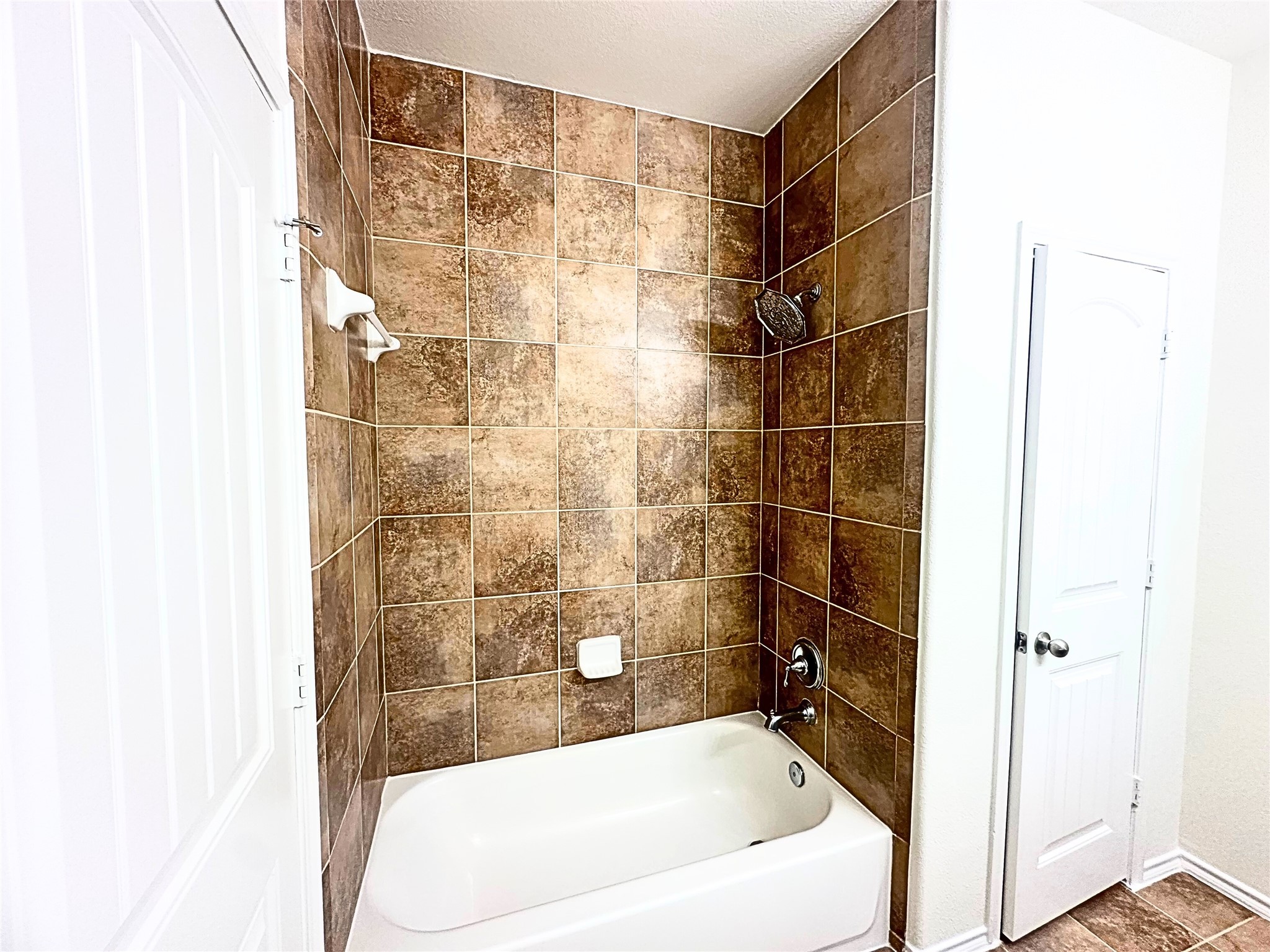 8218 Nagy Hill Street Spring, TX 77379 - Photo 9 of 30 a bathroom with a bathtub and shower