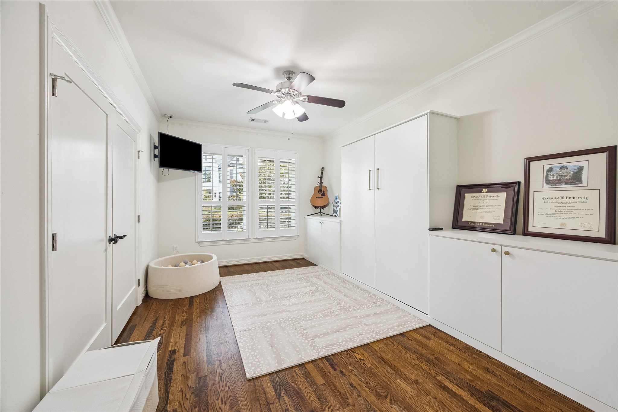 1329 Richelieu Lane Houston, TX 77018 - Photo 24 of 39 Flex room features custom built-ins, a murphy bed and wood flooring. This space is used as a guest bedroom and playroom, and would also make a great home office, study, game room or library