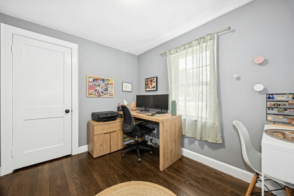 102 Spruce Street Framingham, MA 01701 - Photo 13 of 30 a workspace with furniture and wooden floor