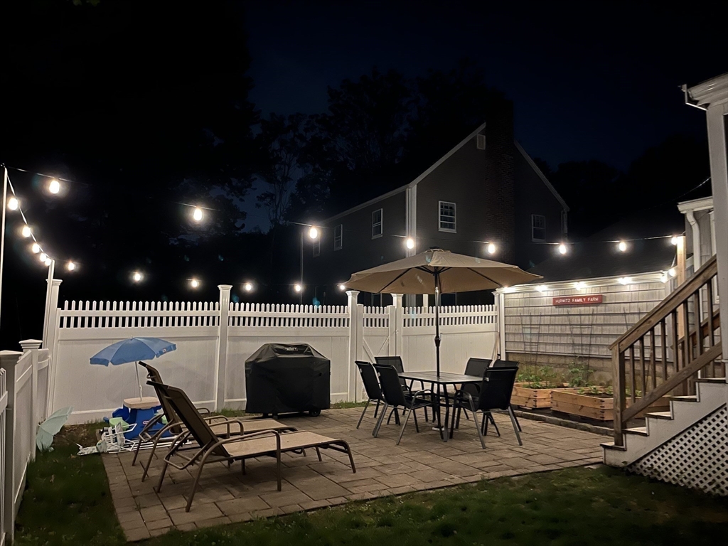 102 Spruce Street Framingham, MA 01701 - Photo 16 of 30 a roof deck with table and chairs