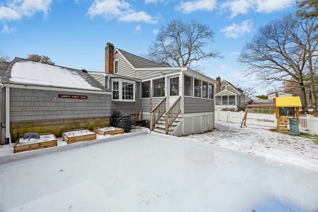 102 Spruce Street Framingham, MA 01701 - Photo 19 of 30 a front view of a house with yard and garage