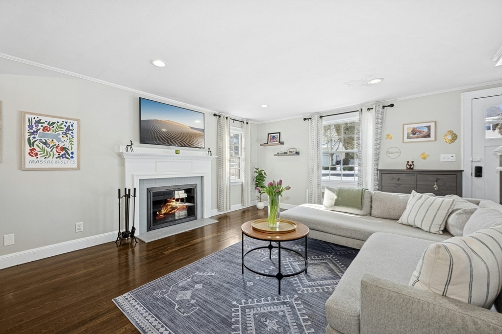 102 Spruce Street Framingham, MA 01701 - Photo 25 of 30 a living room with furniture and a fireplace
