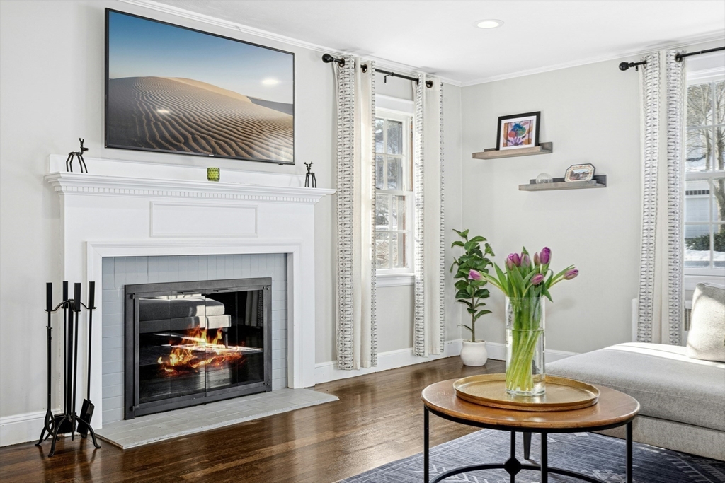 102 Spruce Street Framingham, MA 01701 - Photo 5 of 30 a living room with furniture and a fireplace