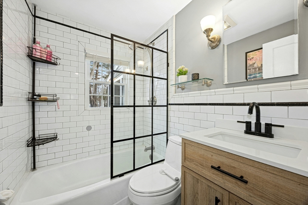 102 Spruce Street Framingham, MA 01701 - Photo 9 of 30 a bathroom with a sink toilet and shower
