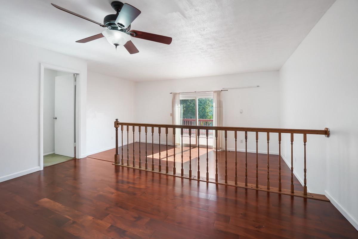 35 Bellfalls Way Nottingham, MD 21236 - Photo 10 of 30 a view of a hallway with wooden floor and a ceiling fan