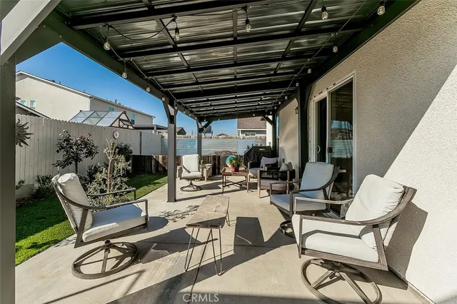 a view of a chairs and table in a patio