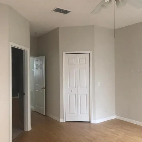 an empty room with closet area