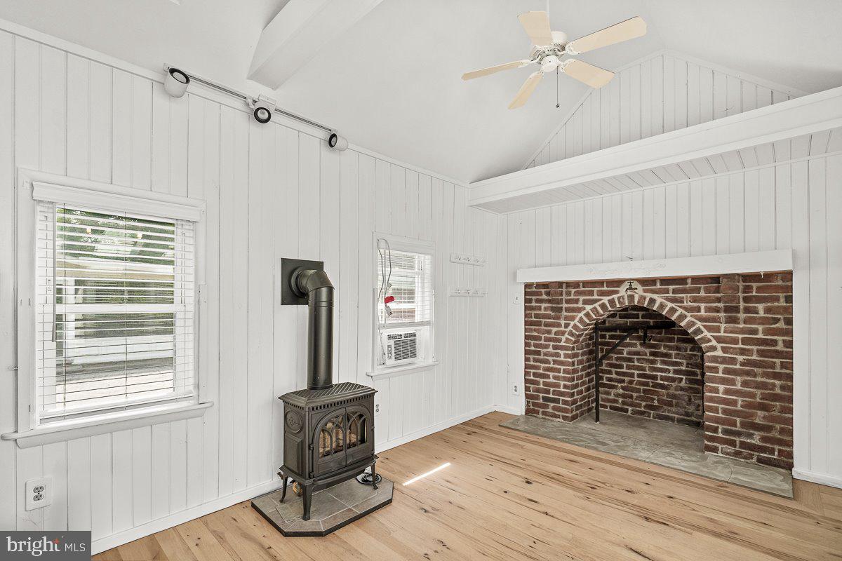 201 East Main Street Fairfield, PA 17320 - Photo 12 of 44 a view of an empty room with a fireplace and wooden floor