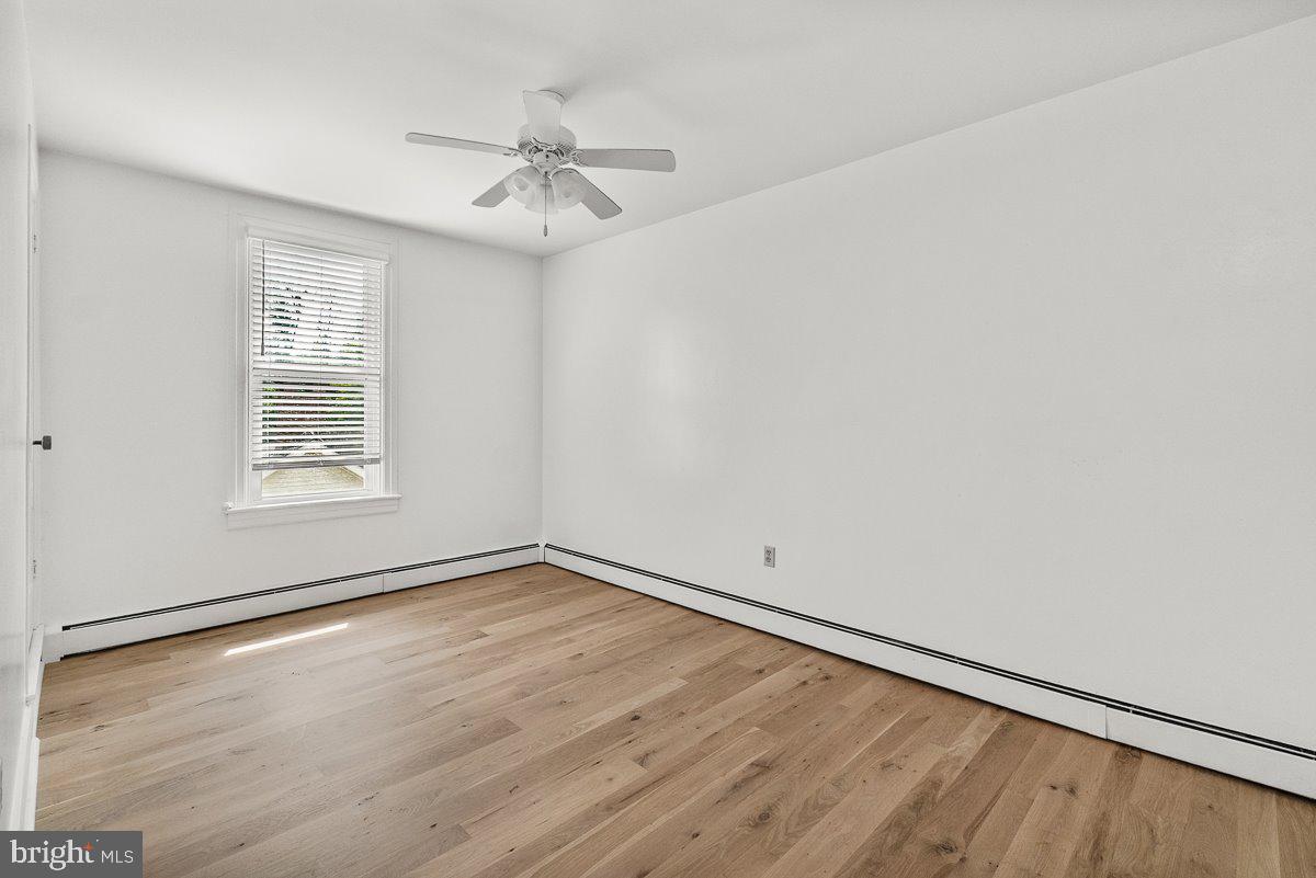201 East Main Street Fairfield, PA 17320 - Photo 16 of 44 wooden floor in an empty room with a window