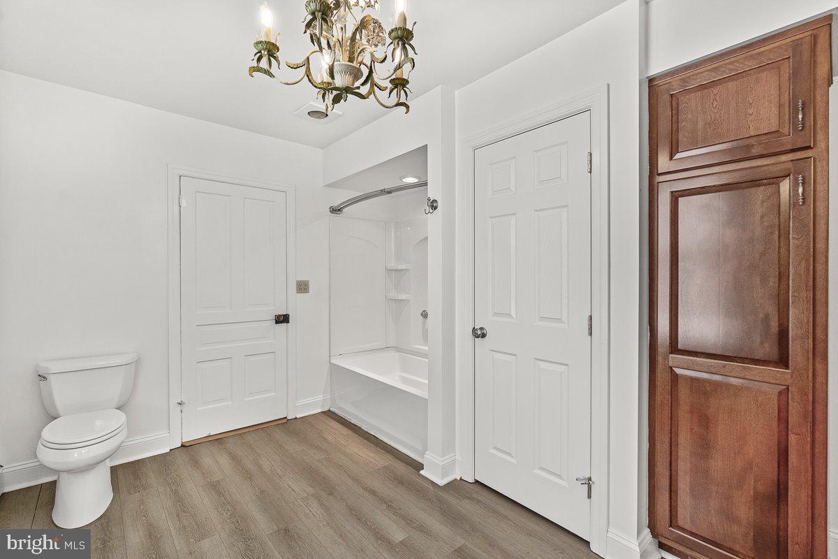 201 East Main Street Fairfield, PA 17320 - Photo 21 of 44 a bathroom with a granite countertop bathtub sink vanity and toilet