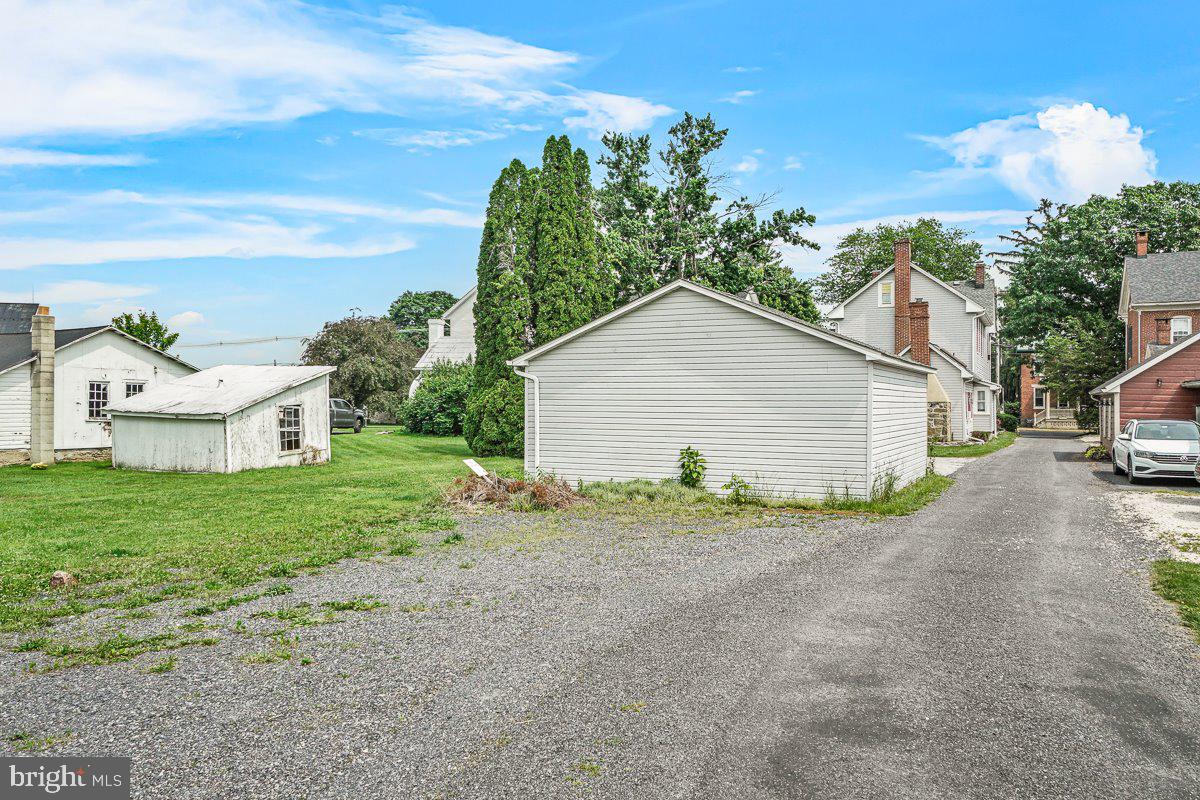 201 East Main Street Fairfield, PA 17320 - Photo 30 of 44 a view of a house with a yard and garage