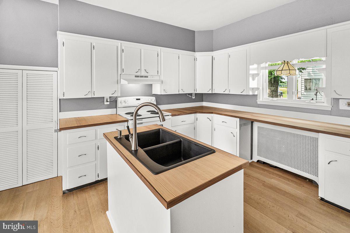201 East Main Street Fairfield, PA 17320 - Photo 6 of 44 a kitchen with white cabinets sink and window