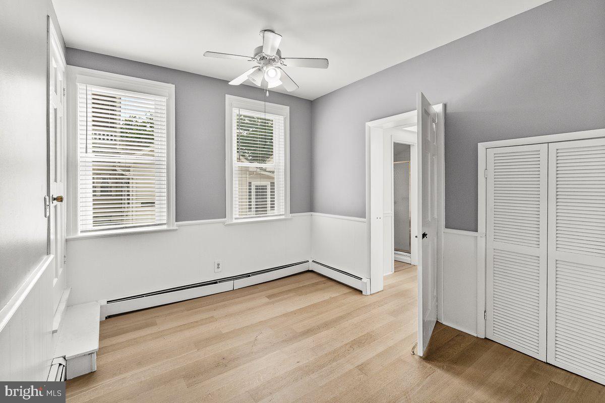 201 East Main Street Fairfield, PA 17320 - Photo 8 of 44 a view of an empty room with a window and wooden floor